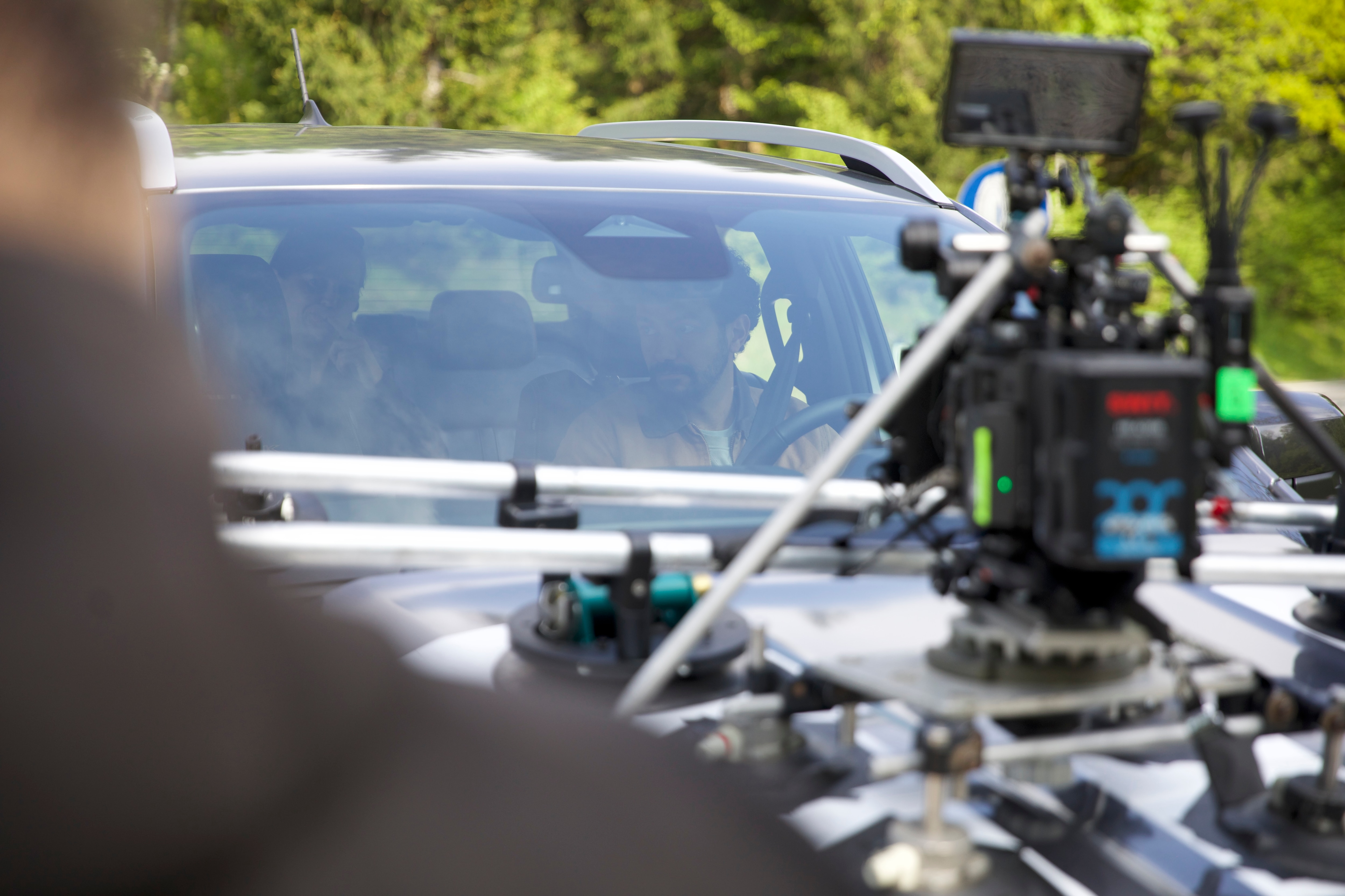 Intricate camera rigs allow for the talent to be filmed from outside while driving
